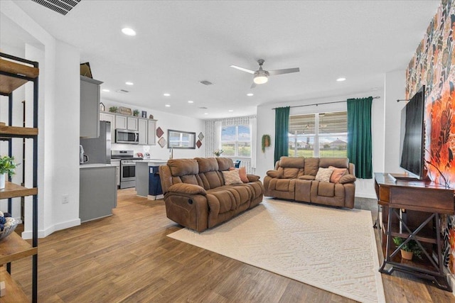 13716 Clerk St, Pflugerville, TX 78660 - living area featuring ceiling fan, light wood-style flooring, and recessed lighting