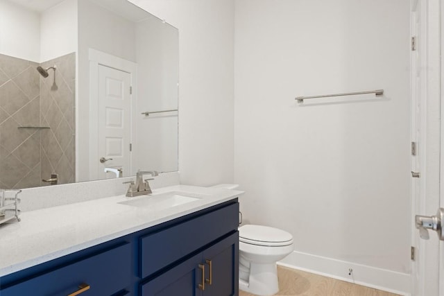 2233 Bellisa Vista Dr, Leander, TX 78641 - bathroom featuring vanity, tiled shower, and wood finished floors