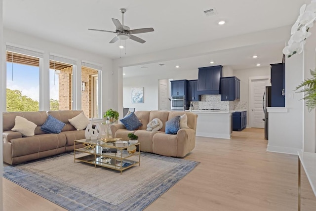 2233 Bellisa Vista Dr, Leander, TX 78641 - living area featuring plenty of natural light, light wood finished floors, a ceiling fan, and recessed lighting
