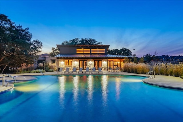 2233 Bellisa Vista Dr, Leander, TX 78641 - pool at dusk with a patio area and an outdoor pool
