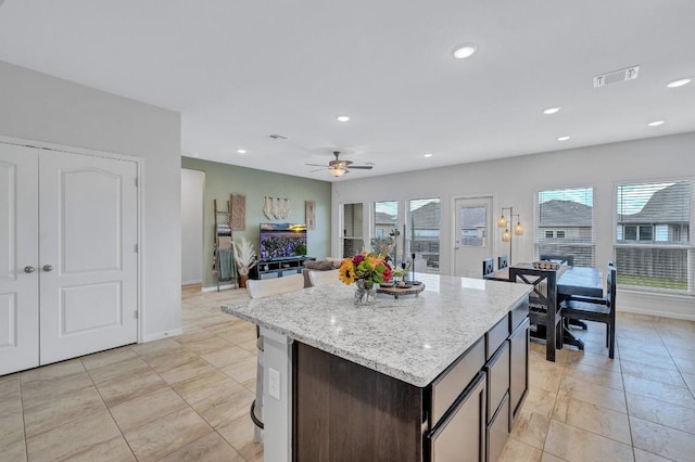 717 Friars Tuck Dr, Temple, TX 76502 - kitchen featuring healthy amount of natural light, a kitchen island, ceiling fan, open floor plan, and recessed lighting