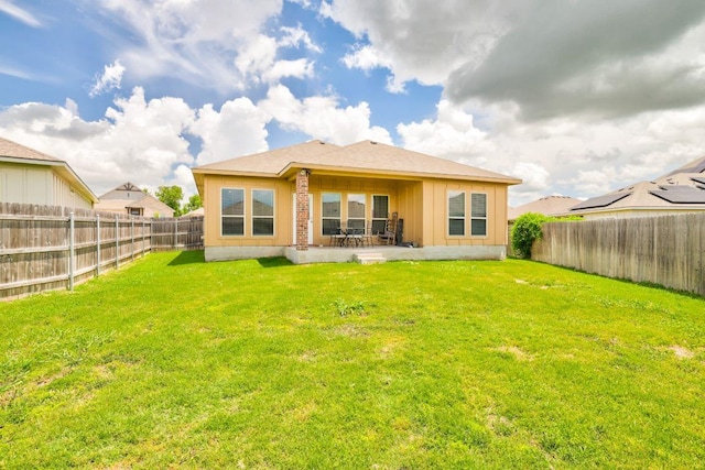 717 Friars Tuck Dr, Temple, TX 76502 - back of house featuring board and batten siding, a fenced backyard, and a patio
