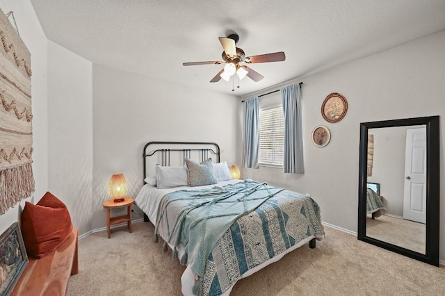 12112 Rancho Alto Rd, Austin, TX 78748 - carpeted bedroom with a ceiling fan and a textured ceiling