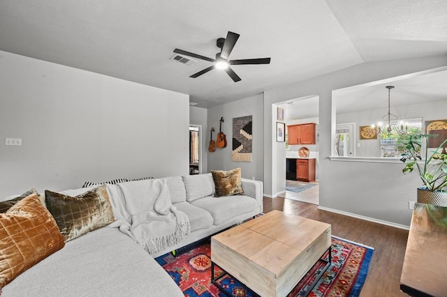 12112 Rancho Alto Rd, Austin, TX 78748 - living area with a chandelier, a ceiling fan, wood finished floors, and vaulted ceiling