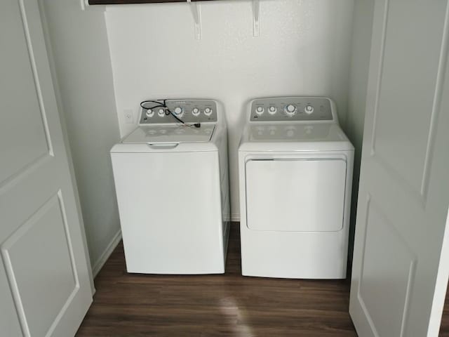 240 Line Of Fire Way, Jarrell, TX 76537 - washroom featuring washing machine and dryer and dark wood-style flooring