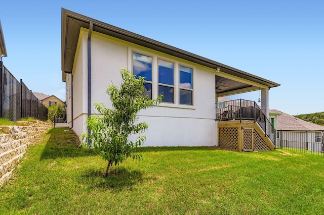 1209 Brasano Pl, Leander, TX 78641 - view of home's exterior featuring stucco siding, stairway, ceiling fan, and a deck