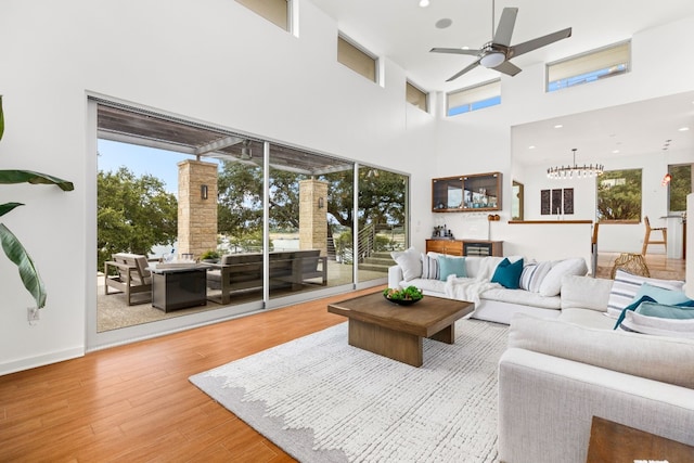 1417 Osprey Ridge Loop, Lago Vista, TX 78645 - living area with a ceiling fan, wood finished floors, plenty of natural light, and a high ceiling