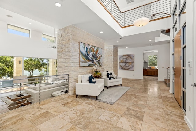 1417 Osprey Ridge Loop, Lago Vista, TX 78645 - building lobby with a high ceiling, recessed lighting, and stairs