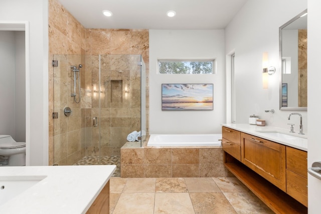 1417 Osprey Ridge Loop, Lago Vista, TX 78645 - full bathroom with vanity, a shower stall, a garden tub, and recessed lighting