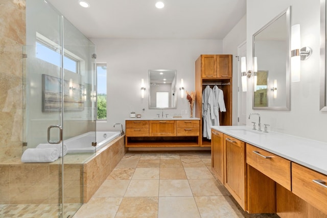 1417 Osprey Ridge Loop, Lago Vista, TX 78645 - full bath with two vanities, a bath, a shower stall, and recessed lighting