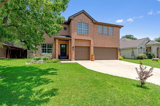 1105 Red Ranch Cir, Cedar Park, TX 78613 - traditional-style home featuring a garage, concrete driveway, and brick siding