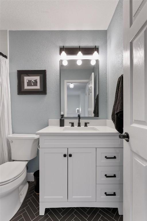 1105 Red Ranch Cir, Cedar Park, TX 78613 - full bathroom with vanity, tile patterned flooring, and a textured wall