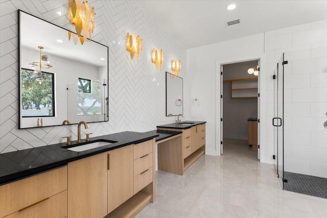 1000 Southlake Ranch Rd, Georgetown, TX 78628 - bathroom with a stall shower, two vanities, backsplash, and recessed lighting