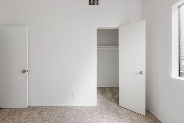 905 Minturn Ln, Austin, TX 78748 - unfurnished bedroom featuring carpet flooring, a closet, and a walk in closet
