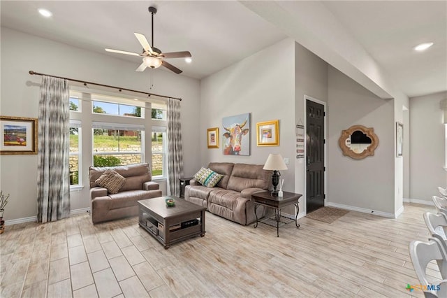 220 Bolivar Way Unit 101, San Marcos, TX 78666 - living area with ceiling fan, light wood-type flooring, a towering ceiling, and recessed lighting