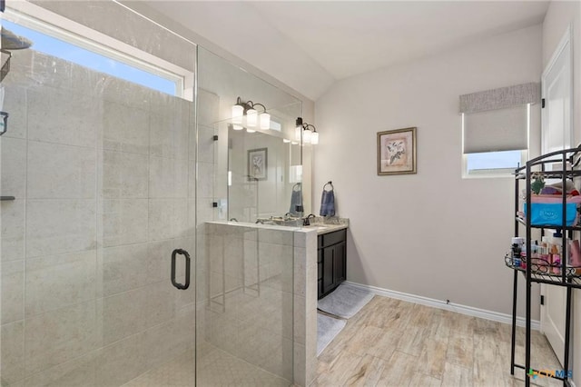 220 Bolivar Way Unit 101, San Marcos, TX 78666 - bathroom with wood finished floors, vanity, and a shower stall