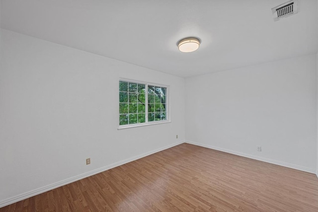 7003 Burnell Dr, Austin, TX 78723 - spare room with wood finished floors and baseboards