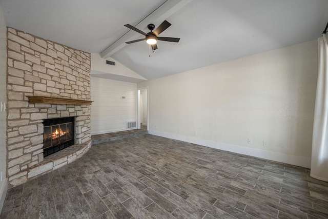 216 Country Rd, Georgetown, TX 78628 - unfurnished living room featuring a ceiling fan, a stone fireplace, and dark wood-style flooring