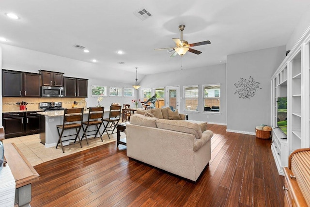 1008 Tabernash Dr, Leander, TX 78641 - living room featuring a ceiling fan, hardwood / wood-style flooring, healthy amount of natural light, and recessed lighting