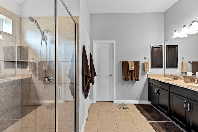 1008 Tabernash Dr, Leander, TX 78641 - full bathroom with double vanity, a stall shower, and tile patterned flooring