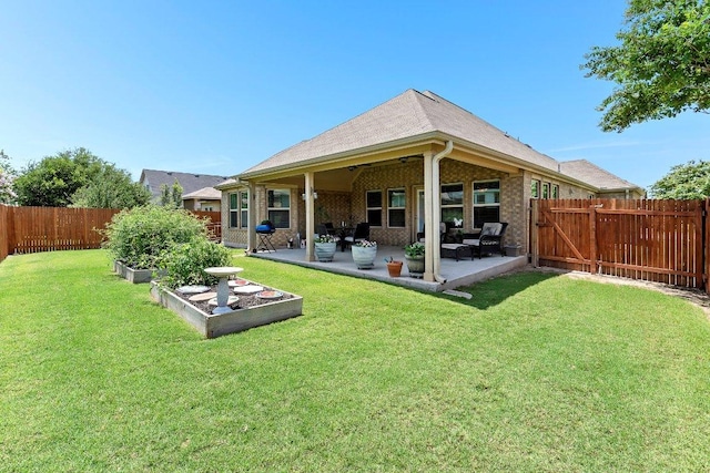 1008 Tabernash Dr, Leander, TX 78641 - rear view of house featuring a fenced backyard, a patio, and a vegetable garden