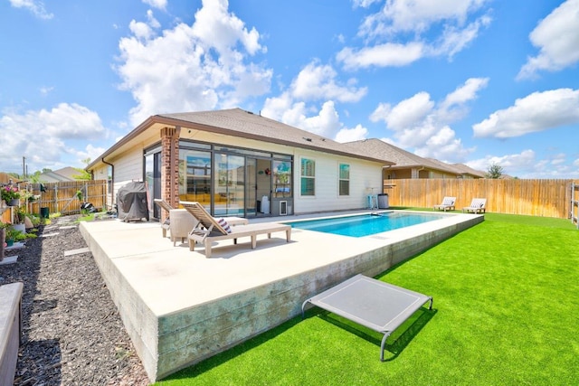 1904 T H Johnson Dr, Taylor, TX 76574 - rear view of house with a fenced backyard and a patio area