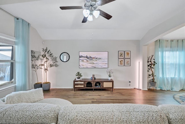 1904 T H Johnson Dr, Taylor, TX 76574 - living room featuring wood finished floors, vaulted ceiling, and ceiling fan