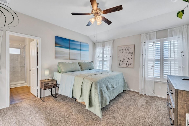 1904 T H Johnson Dr, Taylor, TX 76574 - bedroom featuring multiple windows, light carpet, and ensuite bath