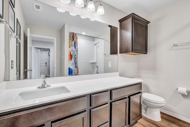 1904 T H Johnson Dr, Taylor, TX 76574 - full bath with vanity, wood finished floors, and a shower with shower curtain