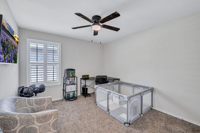 1904 T H Johnson Dr, Taylor, TX 76574 - carpeted bedroom with baseboards and a ceiling fan