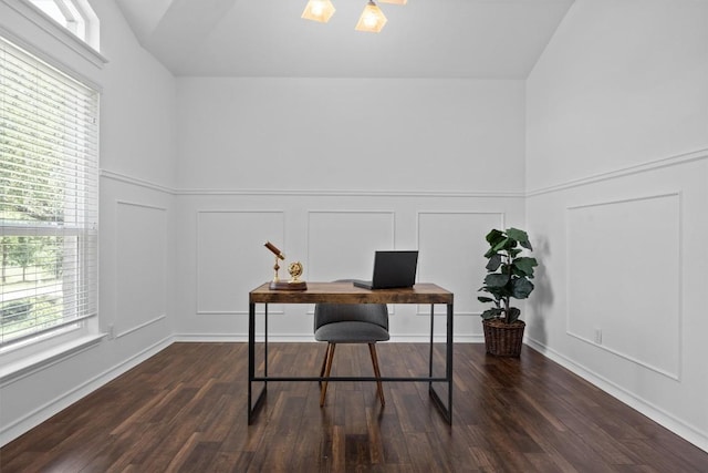 9601 Billingham Trl, Austin, TX 78717 - home office featuring a decorative wall, lofted ceiling, dark wood-style flooring, and a wainscoted wall