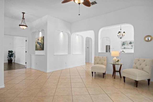 9601 Billingham Trl, Austin, TX 78717 - sitting room featuring arched walkways, ceiling fan, light tile patterned floors, and a chandelier