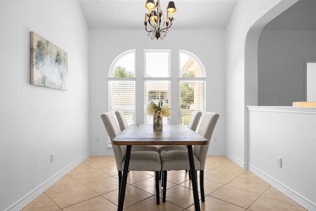 9601 Billingham Trl, Austin, TX 78717 - dining space with a chandelier, light tile patterned flooring, and arched walkways