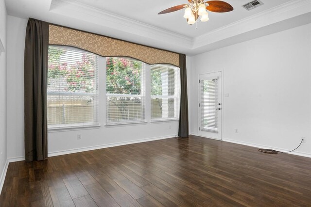 9601 Billingham Trl, Austin, TX 78717 - spare room featuring ceiling fan, wood finished floors, a tray ceiling, and crown molding