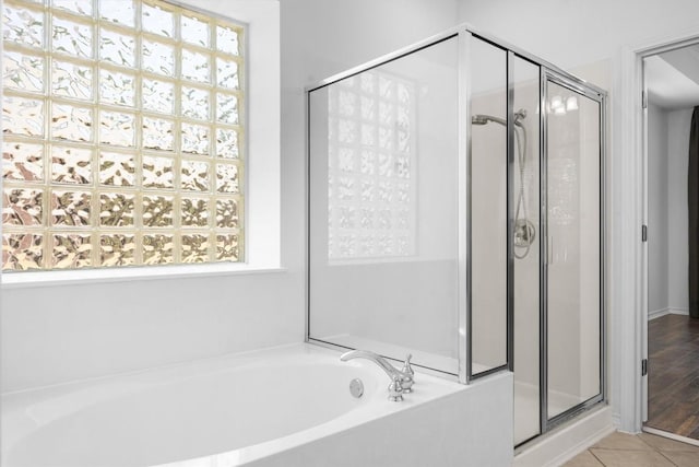 9601 Billingham Trl, Austin, TX 78717 - full bathroom featuring a shower stall, a bath, and healthy amount of natural light