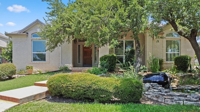 9601 Billingham Trl, Austin, TX 78717 - obstructed view of property featuring brick siding