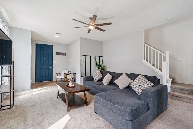 13821 Benjamin Harrison St, Manor, TX 78653 - living area featuring light colored carpet, stairway, a ceiling fan, and recessed lighting