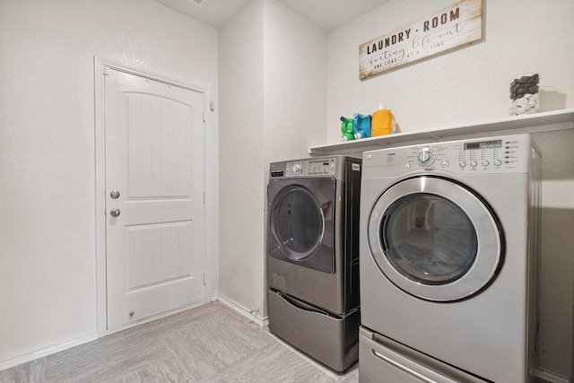 13821 Benjamin Harrison St, Manor, TX 78653 - washroom with washer and clothes dryer and baseboards