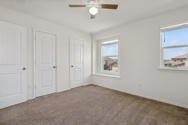 13821 Benjamin Harrison St, Manor, TX 78653 - unfurnished bedroom with carpet, multiple windows, and ceiling fan