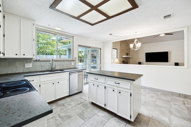 9902 Marseilles Dr, Austin, TX 78750 - kitchen with dishwasher, a textured ceiling, dark countertops, tasteful backsplash, and white cabinets