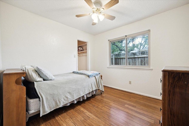 9902 Marseilles Dr, Austin, TX 78750 - bedroom featuring wood finished floors and a ceiling fan