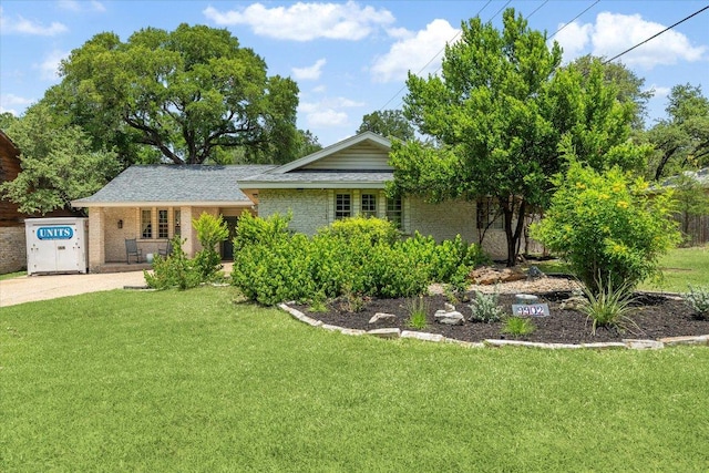 9902 Marseilles Dr, Austin, TX 78750 - view of front of house featuring a front yard and brick siding