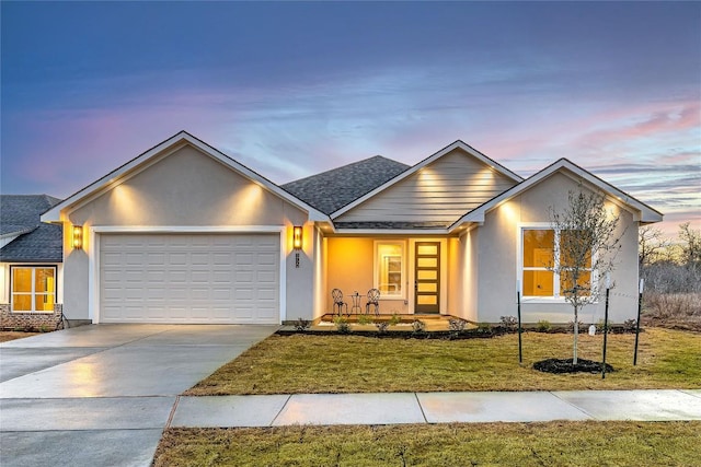 1720 Cannon St, Gonzales, TX 78629 - view of front of house featuring an attached garage, a front lawn, concrete driveway, and roof with shingles