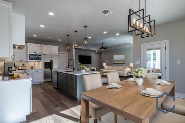 1720 Cannon St, Gonzales, TX 78629 - dining space with dark wood-style floors, ceiling fan, and recessed lighting