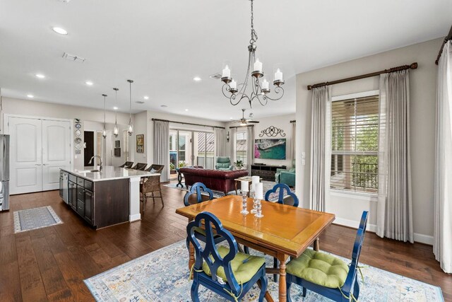 249 Hopping Peach St, San Marcos, TX 78666 - dining space featuring a chandelier, recessed lighting, and dark wood-style floors