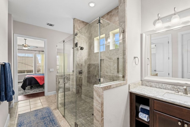 249 Hopping Peach St, San Marcos, TX 78666 - full bath featuring ensuite bath, vanity, a stall shower, tile patterned floors, and ceiling fan