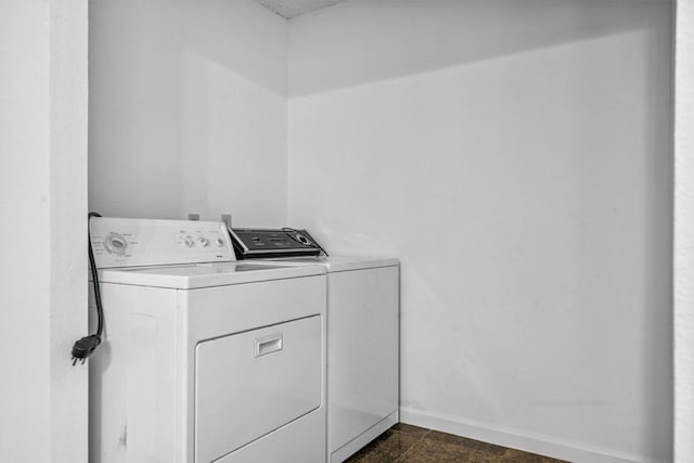 6308 Shadow Bnd, Austin, TX 78745 - washroom with washing machine and clothes dryer and baseboards