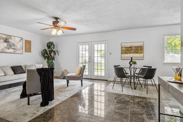 6308 Shadow Bnd, Austin, TX 78745 - dining space featuring granite tiled floors, french doors, a textured ceiling, and ceiling fan