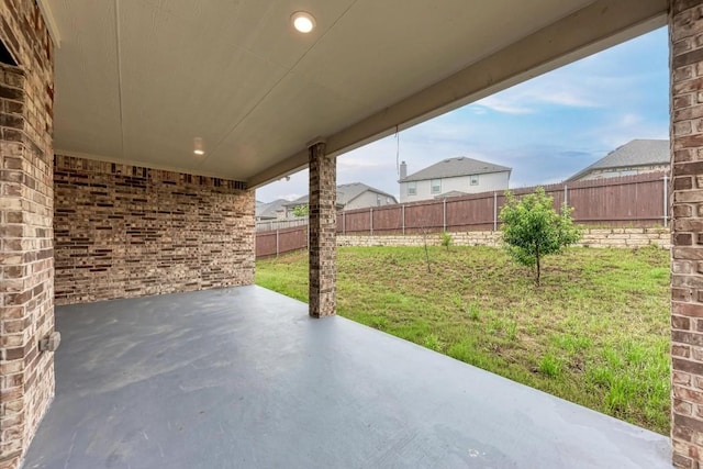 7517 Knockfin Dr, Austin, TX 78744 - fenced backyard featuring a patio