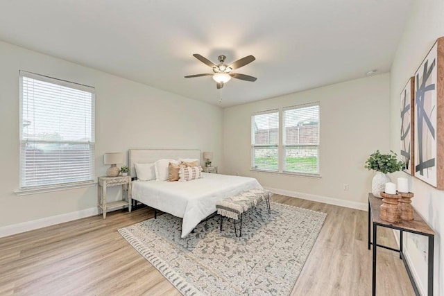 7517 Knockfin Dr, Austin, TX 78744 - bedroom featuring light wood-type flooring and a ceiling fan